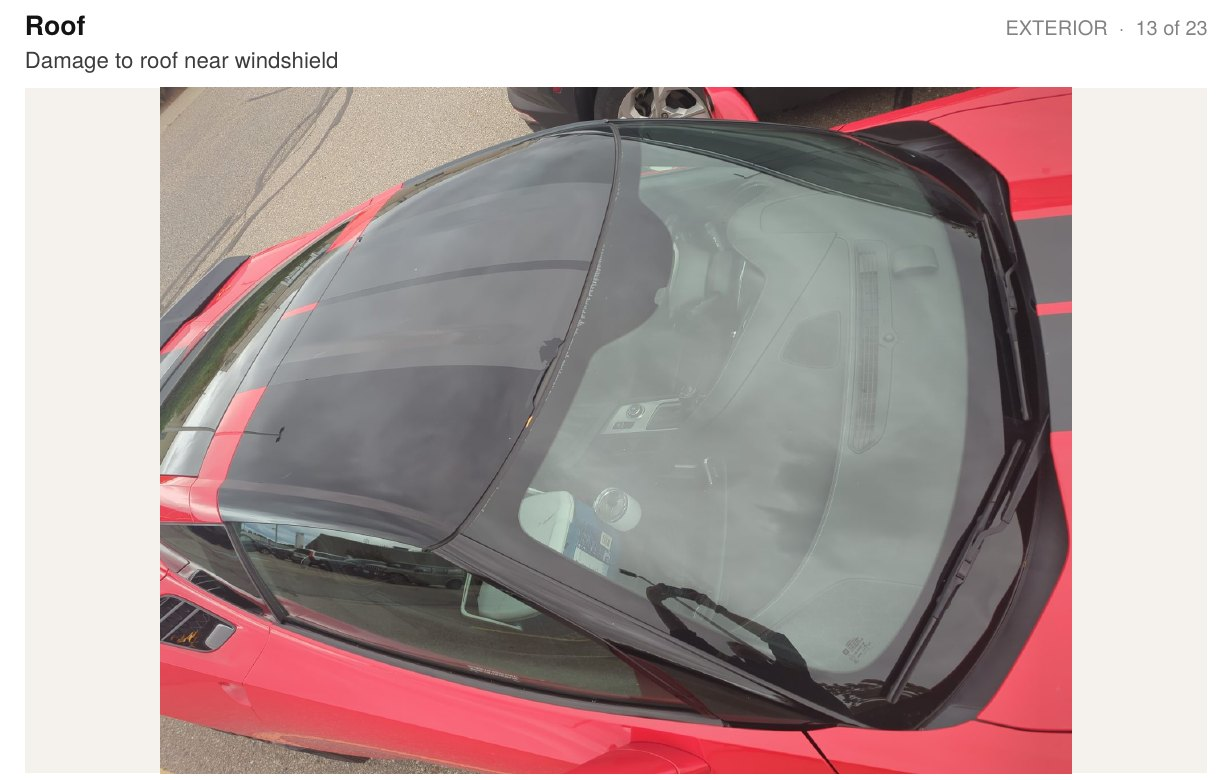 Inspection report page showing the roof near the windshield with a note about damage